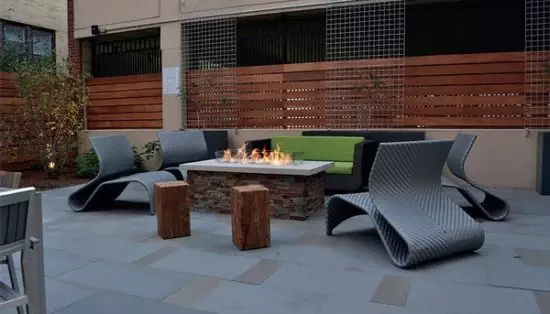 propane fire pit on patio with chairs