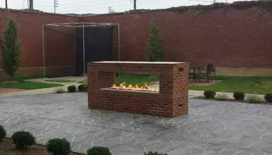 outdoor rectangular fire pit with propane flames